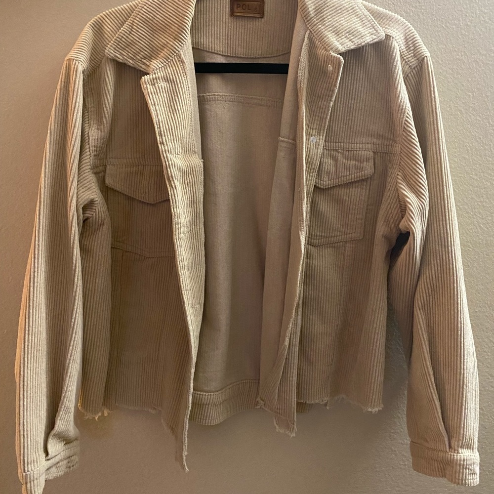 Beige corduroy jacket with distressed ends from boutique Isabelle’s Cabinet